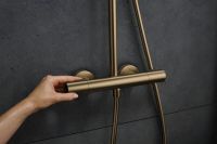 Душевая система с термостатом Hansgrohe Pulsify S Puro бронза 24223140